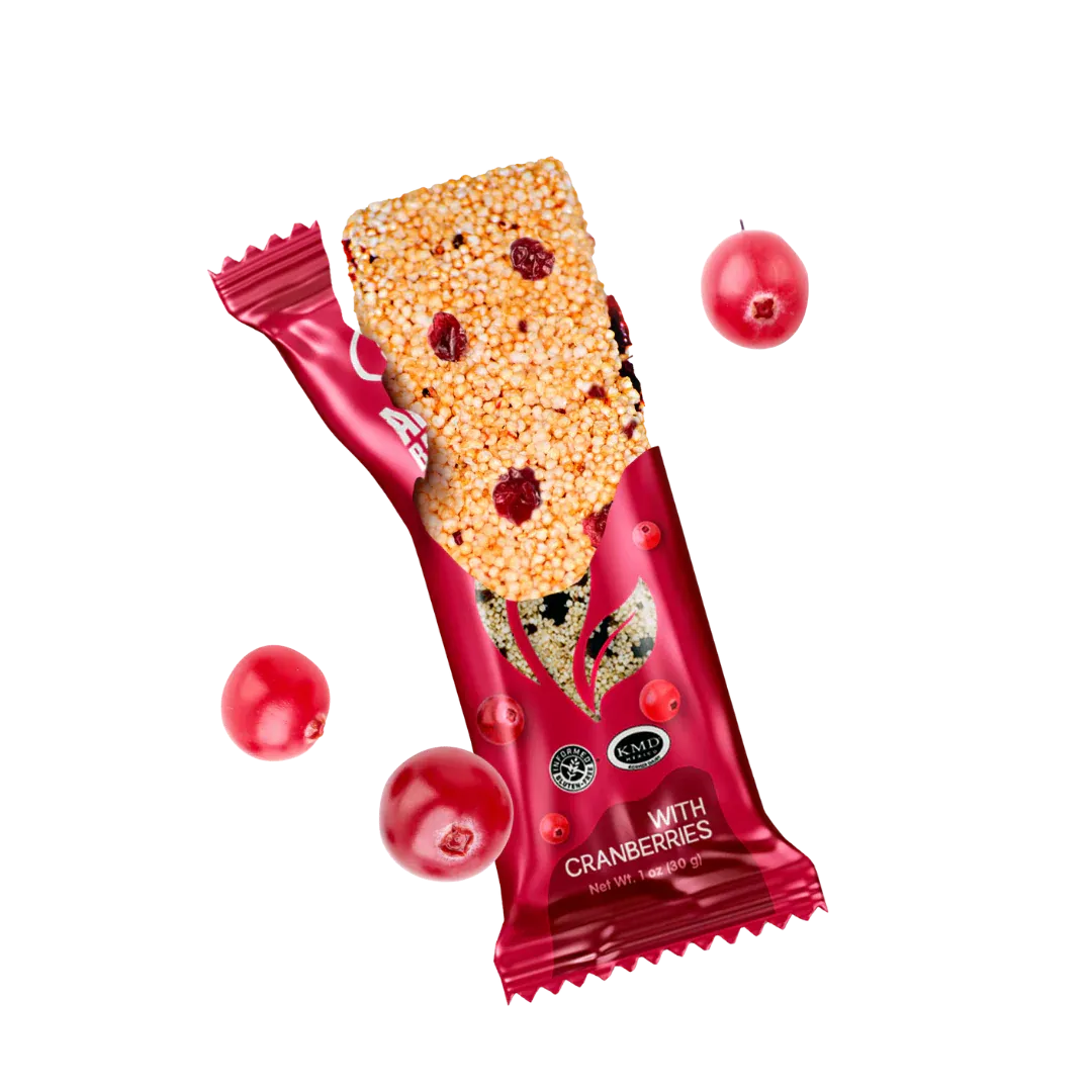 Nutri Well amaranth bar with cranberries in pink wrapper with floating cranberries