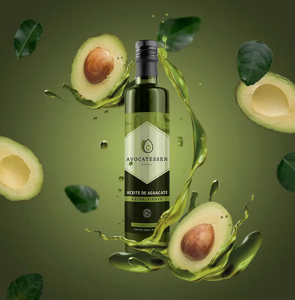 Avocatessen avocado oil bottle with floating avocado halves and leaves