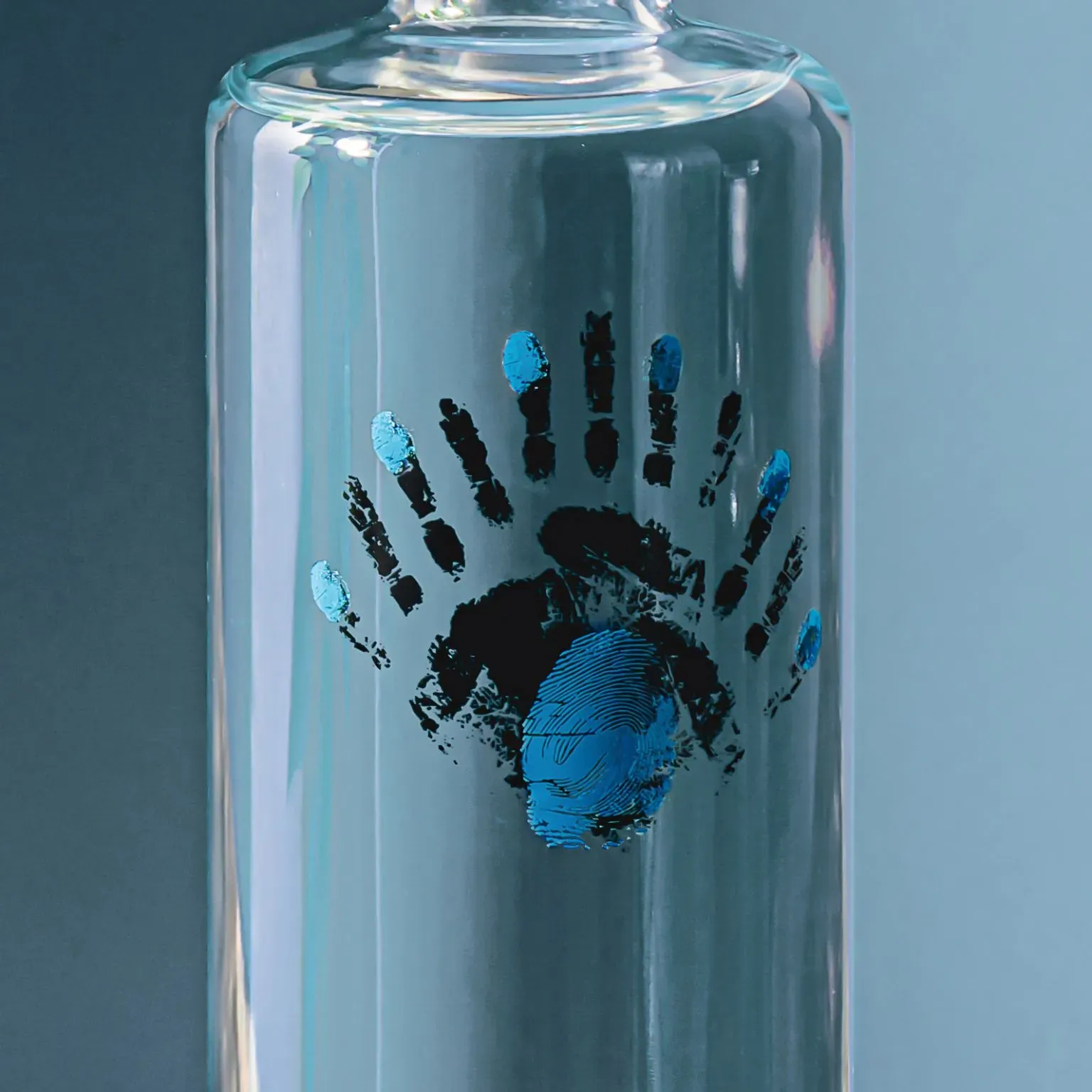Blanco bottle handprint logo close-up on blue background