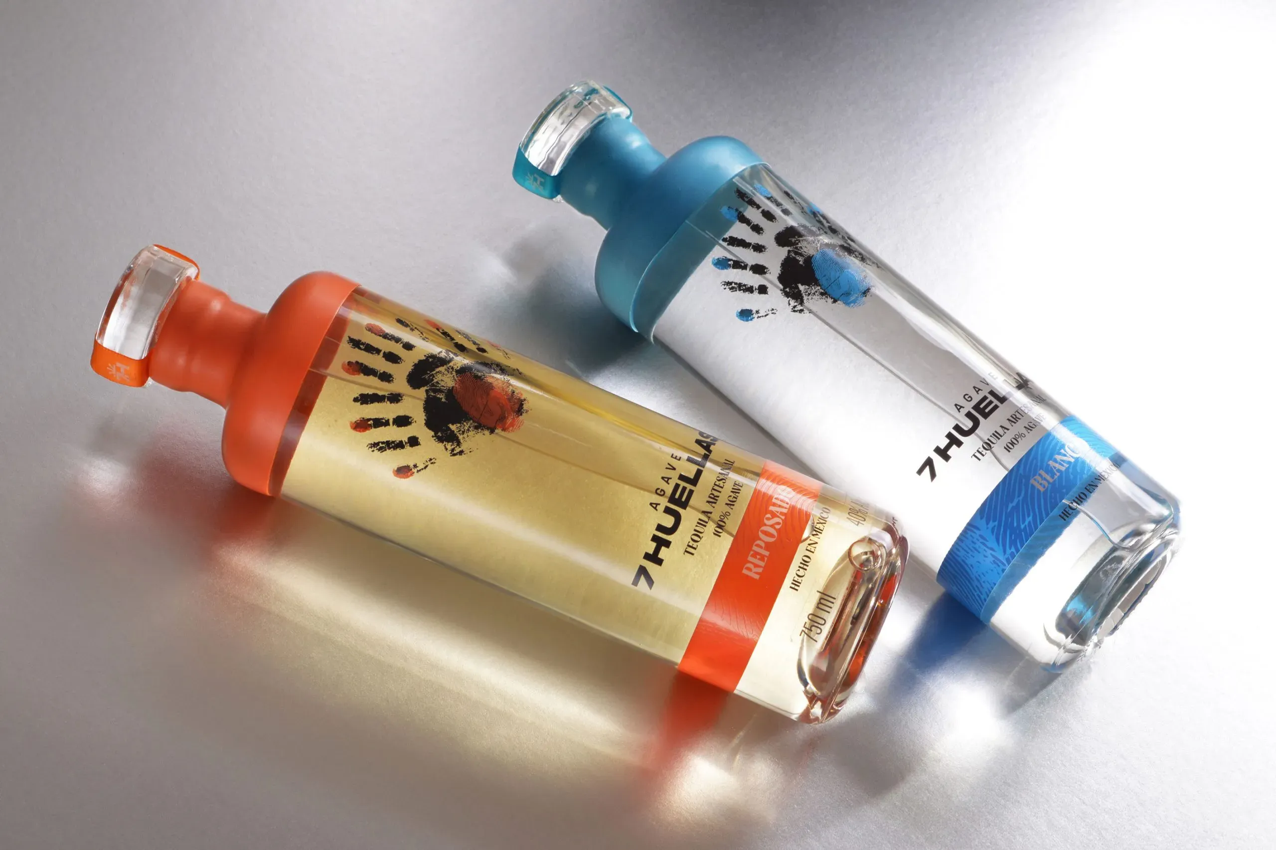 Blanco bottle overhead on brushed metallic surface