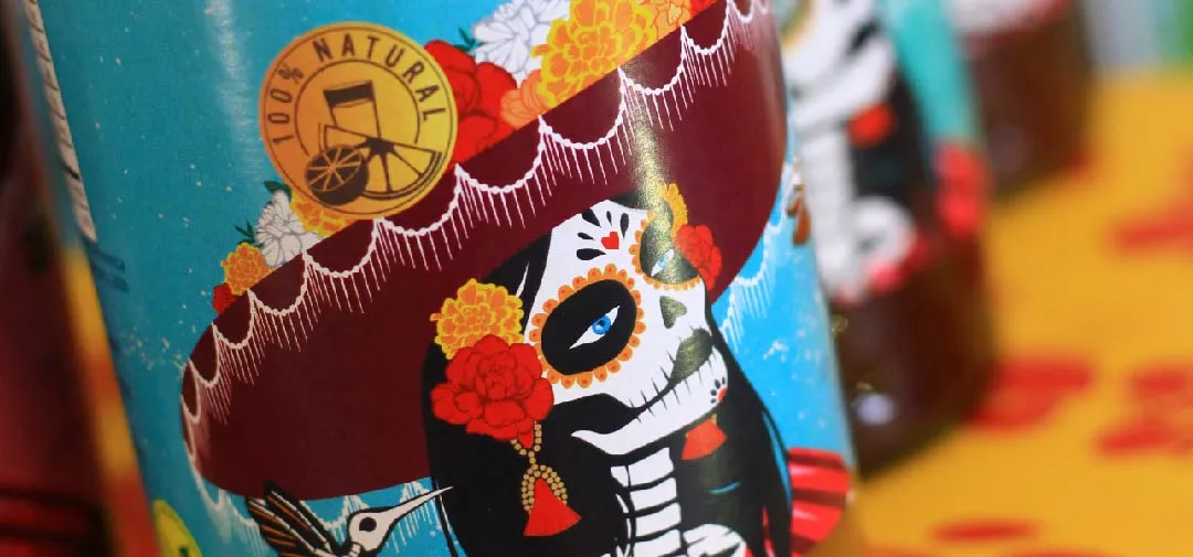 Close-up of La Flaca catrina bottle label artwork with 100% Natural seal