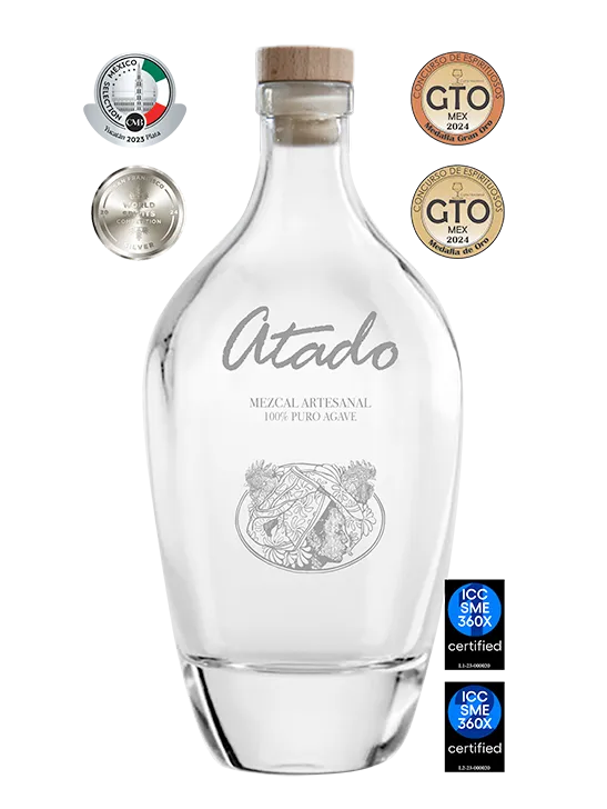 Atado bottle displayed with competition medals and certification badges