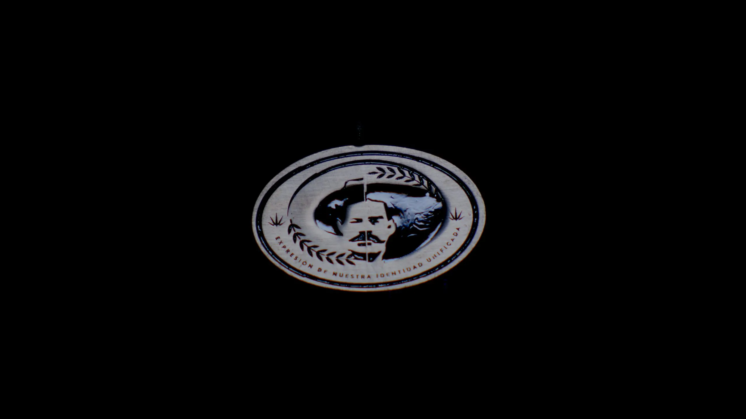 Villa y Zapata brand medallion with dual portrait on black background