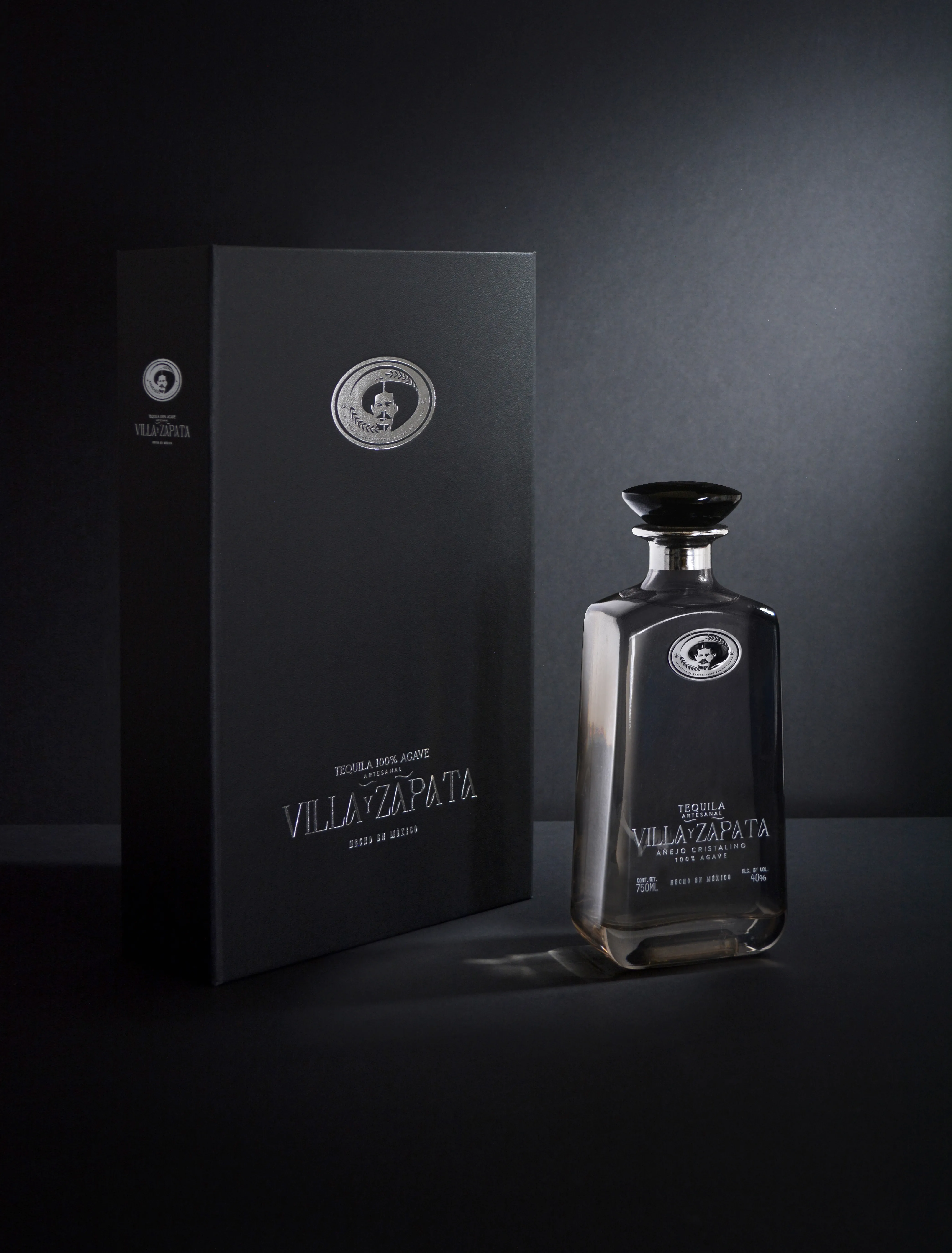 Cristalino bottle with black gift box on dark background