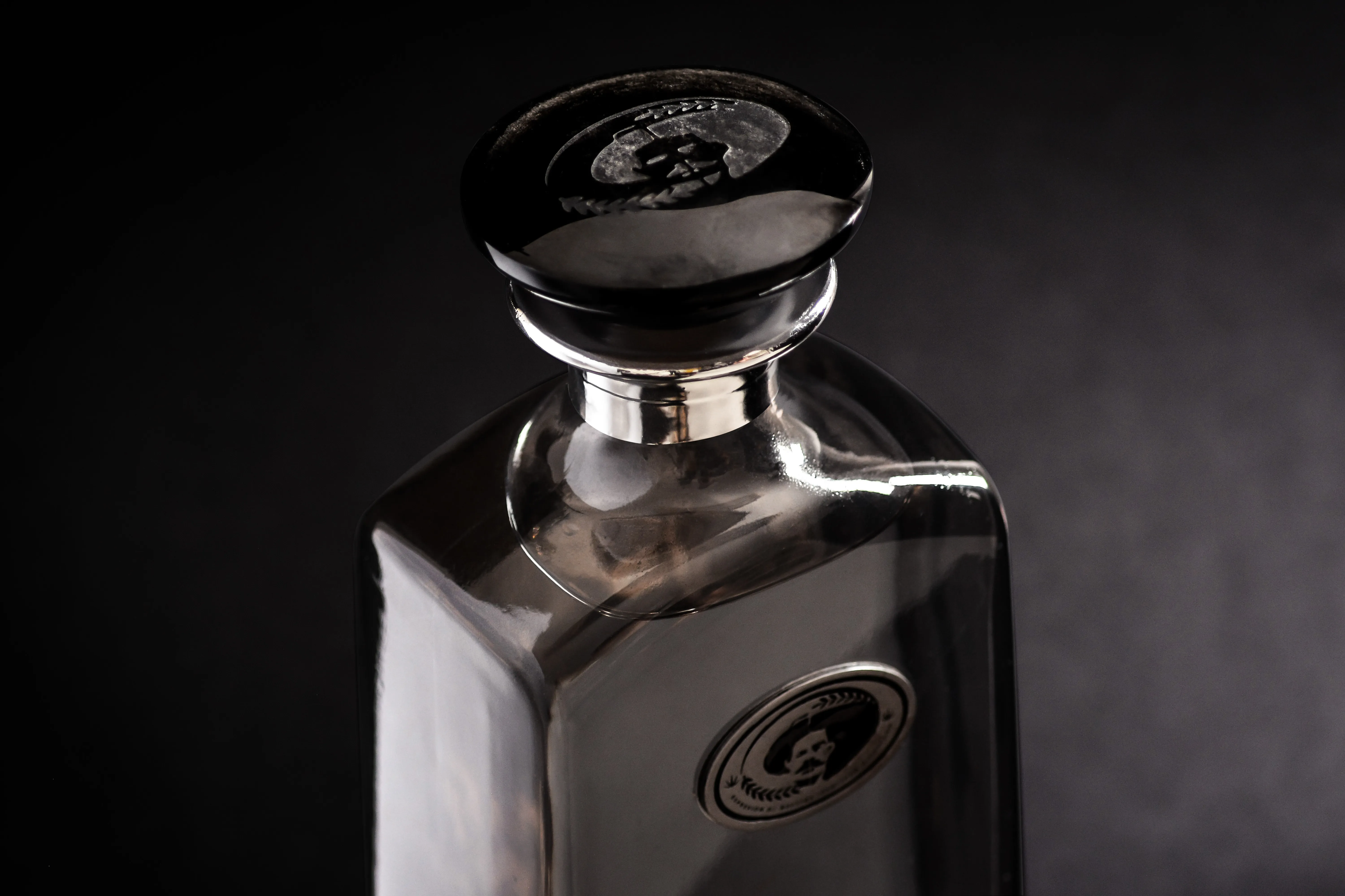 Cristalino bottle cap and neck close-up on dark background