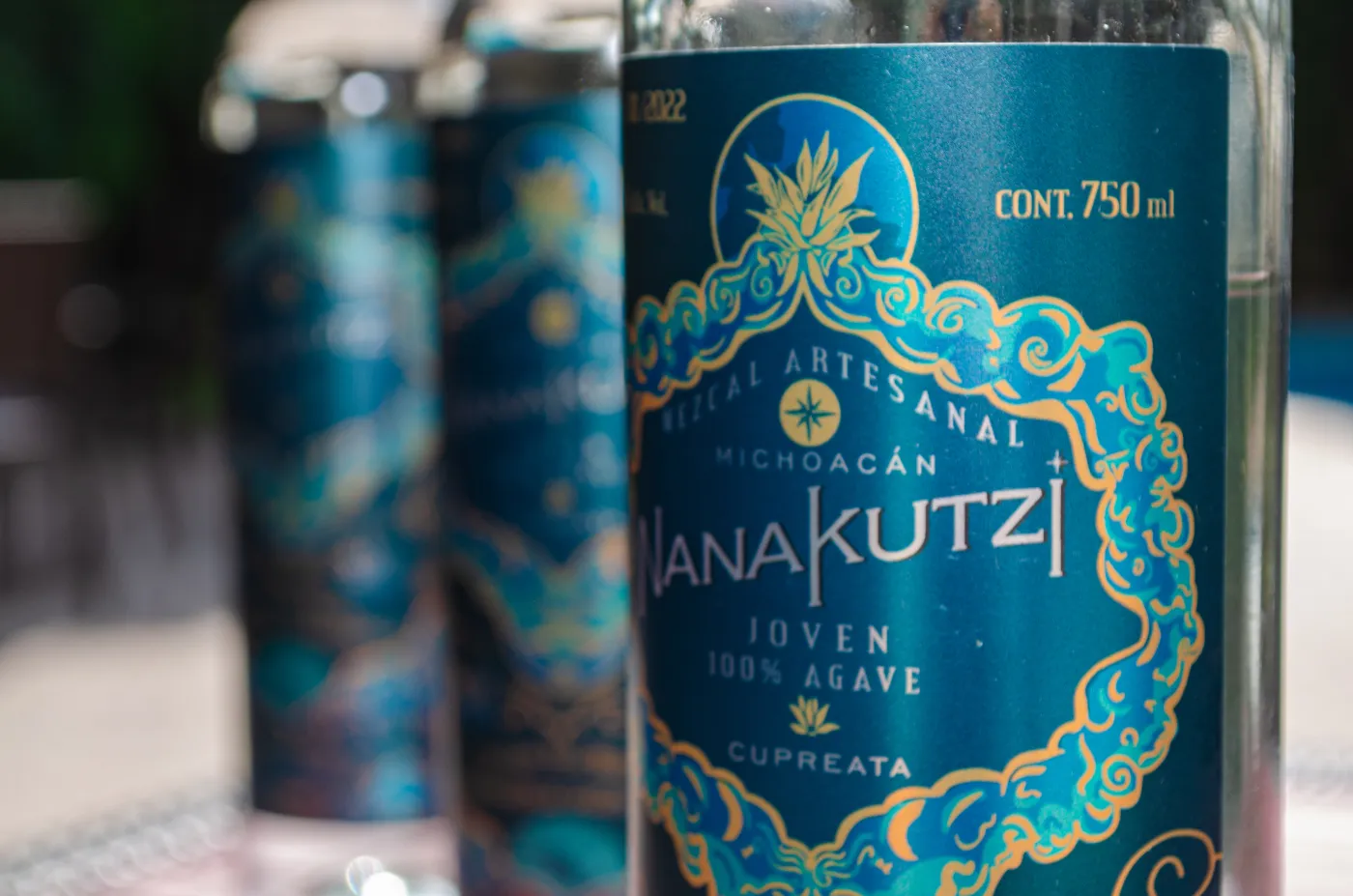 Nanakutzi Cupreata label detail with bottles in background