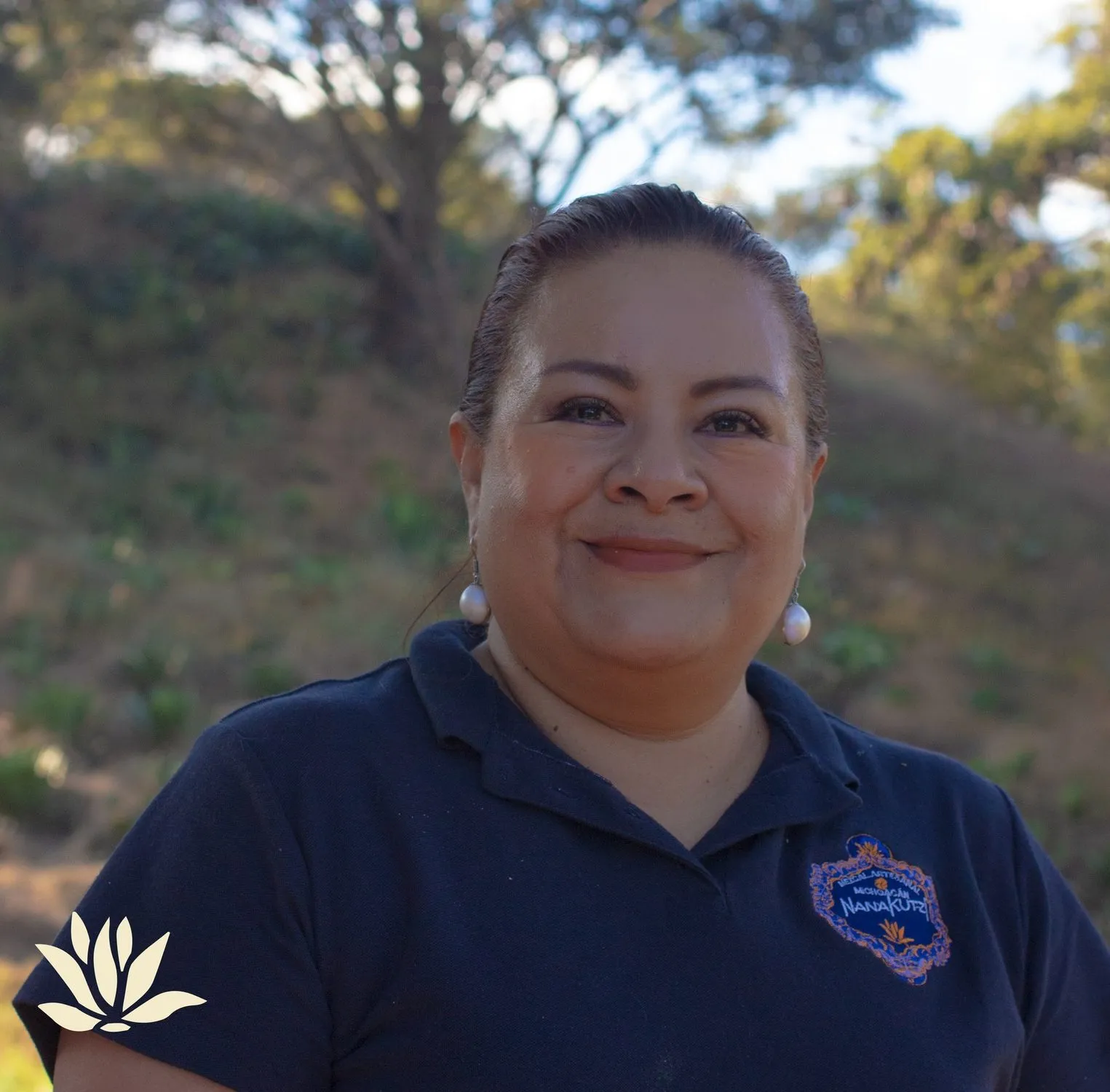 Founder Luz María Saavedra portrait outdoors wearing Nanakutzi polo