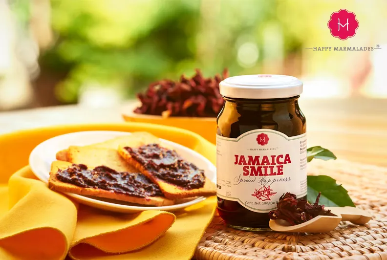 Jamaica Smile hibiscus spread jar with dark preserve on toast slices