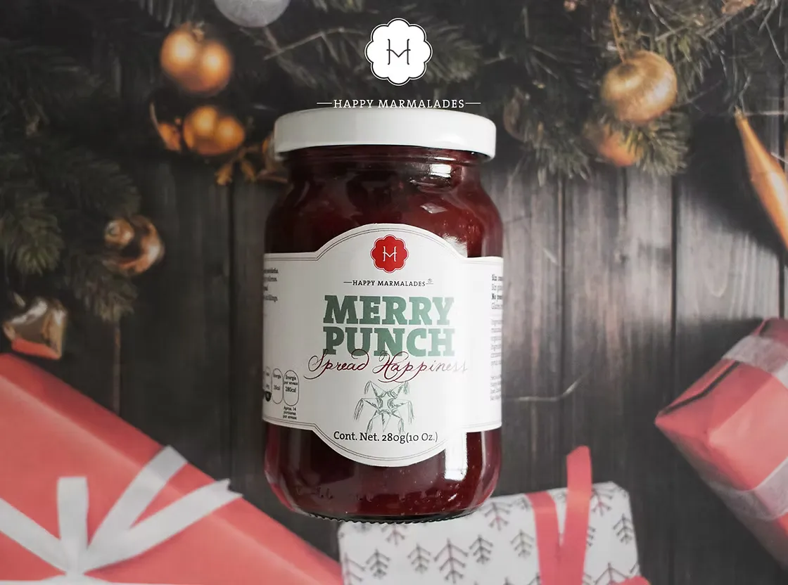 Merry Punch holiday edition jar with festive Christmas wreath and gift box backdrop