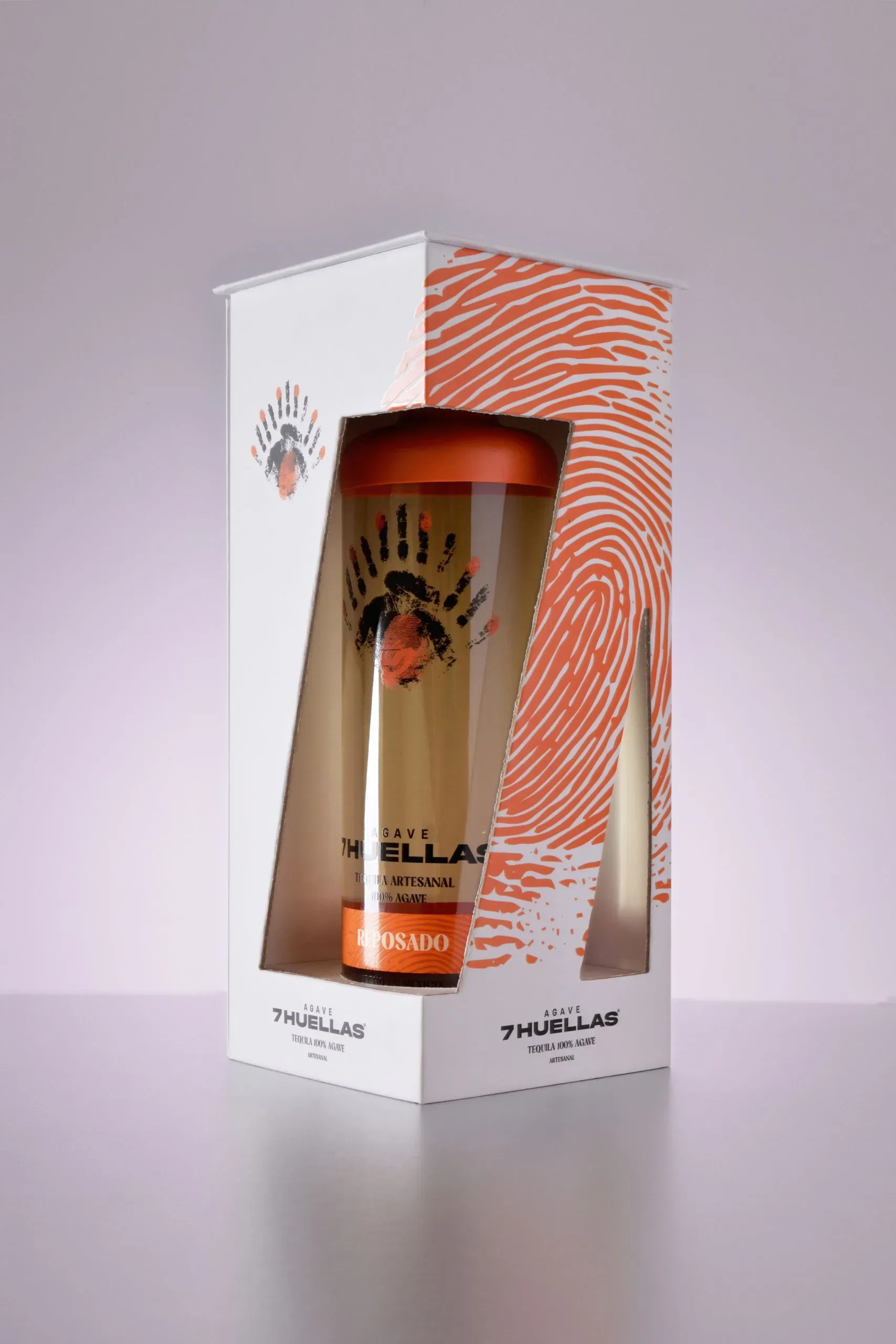 Reposado bottle in gift box with orange fingerprint design