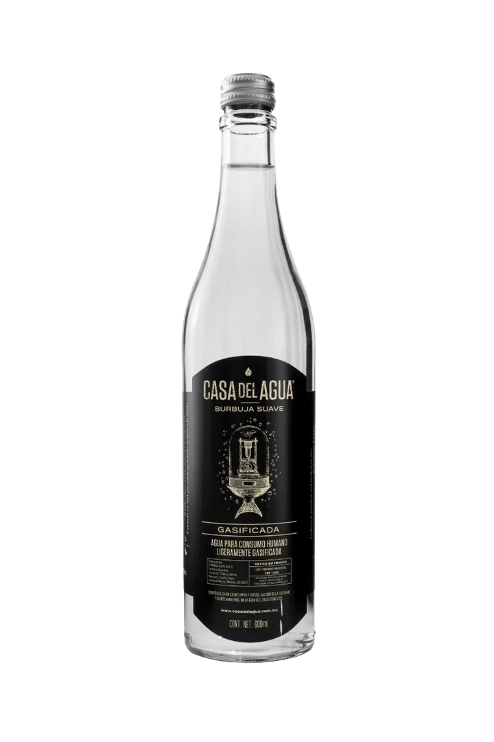 Close-up of Casa del Agua Gasificada sparkling water bottle with black and gold label